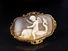 Unusual Cameo of a boy riding a Dolphin in Gold coloured mount