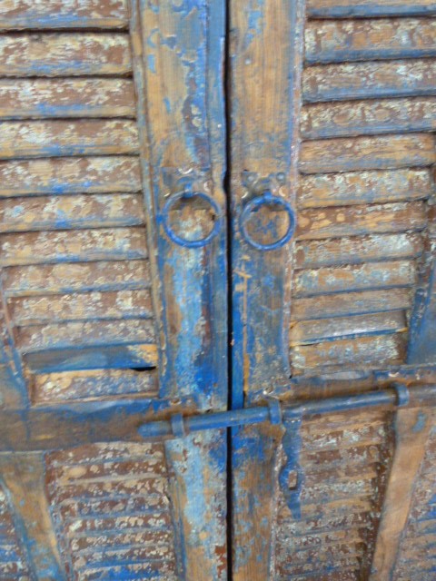 Moroccan heavily distressed two door eight panelled cupboard with two shelves and bolt lock - Image 3 of 4