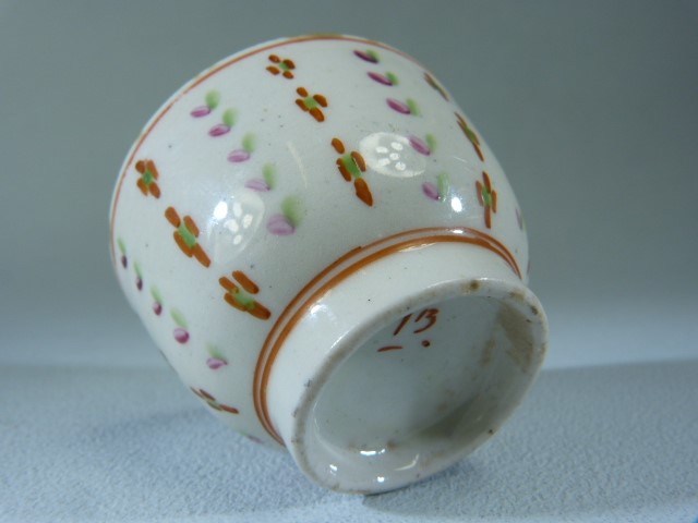 Miniature (unmarked) Sake cup. Decorated in underglaze Ochre, Green and Pink with floral stripes. - Image 3 of 3