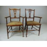 Pair of Antique open arm side chairs with pierced splat back.