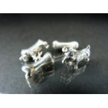 Pair of silver cufflinks each in the form of a dog and bone