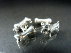 Pair of silver cufflinks each in the form of a dog and bone