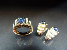 By Vourakis: A set of 18ct Gold earrings and 18ct Gold ring. Each set with a large Cabochon Sapphire