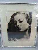 Joan Crawford, portrait by Clarence Sinclair Bull, blind embossed. 11 inches x 14 inches.