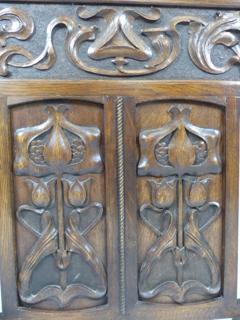 Arts and Crafts oak carved Fire screen - decorated with three panels depicting Tulips and pierced - Image 2 of 5