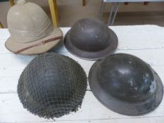 MILITARIA - Four military helmets to include a Fire Brigade helmet