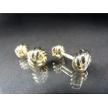 Cufflinks: A pair of gold plated cufflinks in the form of knots