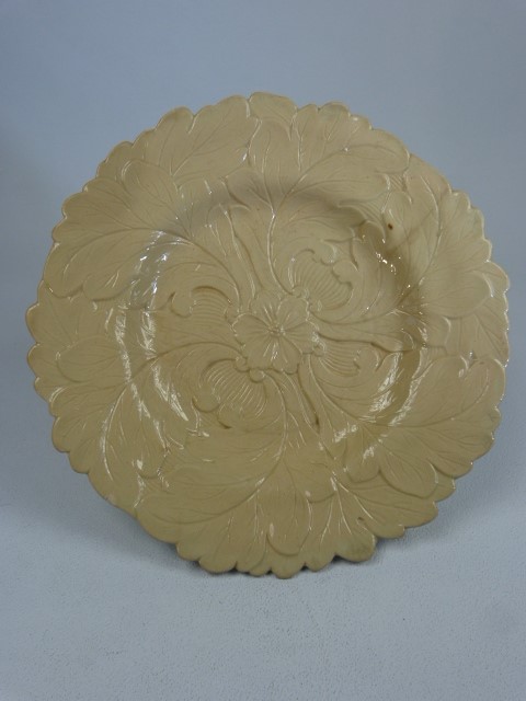 Victorian Pottery earthenware moulded plate with central flower and leaf decoration.