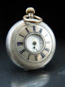 Silver cased 800 marked half hunter pocket watch with engine turned decoration and subsidiary second