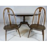 Ercol drop leaf dining table with two swan back chairs