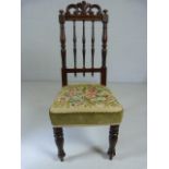 Victorain childs chair with turned back and a floral tapestry seat