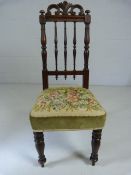 Victorain childs chair with turned back and a floral tapestry seat