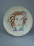 Poole Pottery Art Deco plate depicting a lady with flowers in her hair.