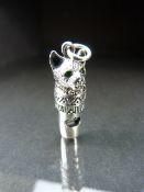 Silver whistle in the form of a cat with emerald eyes