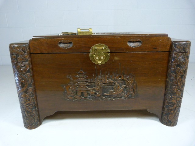 Oriental heavily carved camphor wood chest