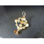 Floral 9ct pendant set with two Citrine stones