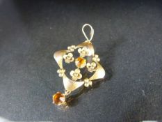 Floral 9ct pendant set with two Citrine stones