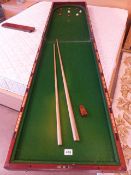 Early Victorian folding Bagatelle board in mahogany. All numbered cups in good original condition.