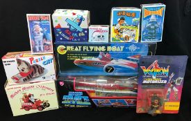 Ten tinplate and plastic mechanical toys by various Japanese and other manufacturers, includes