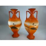 Pair of Sale Vases depicting a sunset over a deserted island.
