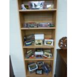 Large collection of Die cast toy busses and trams over the shelving unit