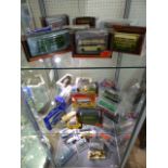 Model buses over three shelves - mainly all boxed