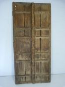 Two antique Moroccan wooden doors with metal fittings