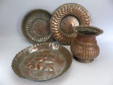 Middle Eastern copper wares to include Trays and an urn type jug