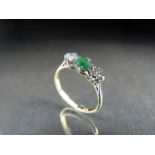 Yellow Gold three Stone Diamond and Emerald ring. Approx weight - 2g