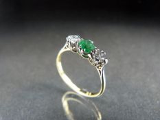 Yellow Gold three Stone Diamond and Emerald ring. Approx weight - 2g