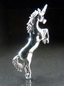 Silver (Sterling) brooch in the form of a unicorn.