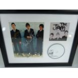 THE JAM - Mounted and framed signed photograph of the Jam by all three band members, frame also