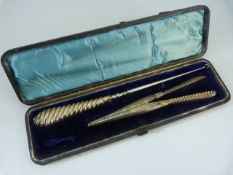 Cased button hook and glove stretcher both with silver hallmarked handles