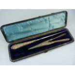 Cased button hook and glove stretcher both with silver hallmarked handles