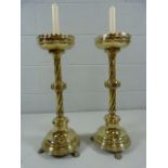 Brass antique Alter sticks on lion pad feet leading to twisted column and galleried bowl. The