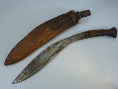 Late 19th century wooden handled Kukri knife with leather scabbard. Unmarked blade.