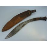 Late 19th century wooden handled Kukri knife with leather scabbard. Unmarked blade.