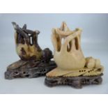 Chinese pair of similar carved Soapstone figures on soapstone bases depicting Buddha's hand.