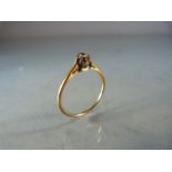 Single solitaire diamond ring on gold band (hallmarks rubbed) size P