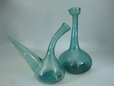 Two Antique green glass bottles. One of mallet form. Both with rough pontil to base.