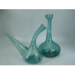 Two Antique green glass bottles. One of mallet form. Both with rough pontil to base.