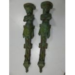 Pair of decorative plaster wall sconces in the form of ladies with crossed arms.