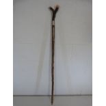 Unusual walking stick inset with coins to top.