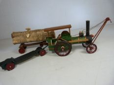 Small hand made model steam engine, with log trailer and one other.