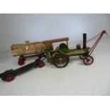 Small hand made model steam engine, with log trailer and one other.