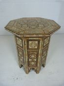 Hexagonal side table with decorative inlay of mother of pearl and ivory. Imported from Morocco. Good