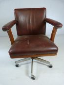 Vintage Leather captains chair with metal studding on metal base