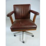 Vintage Leather captains chair with metal studding on metal base