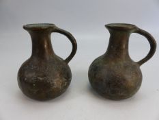 Pair of Bronze primitive jugs/ vessels