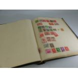 Stamp album containing stamps from around the world and a small selection of First Day covers.
